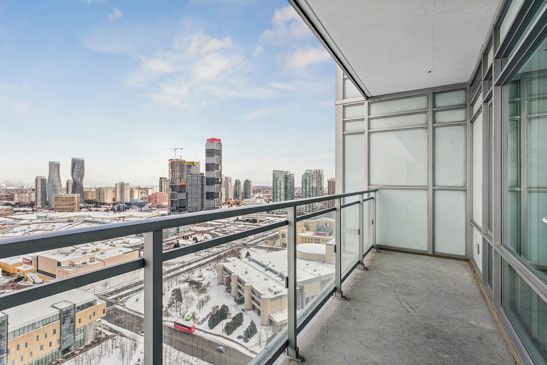Private condo balcony overlooking the city skyline