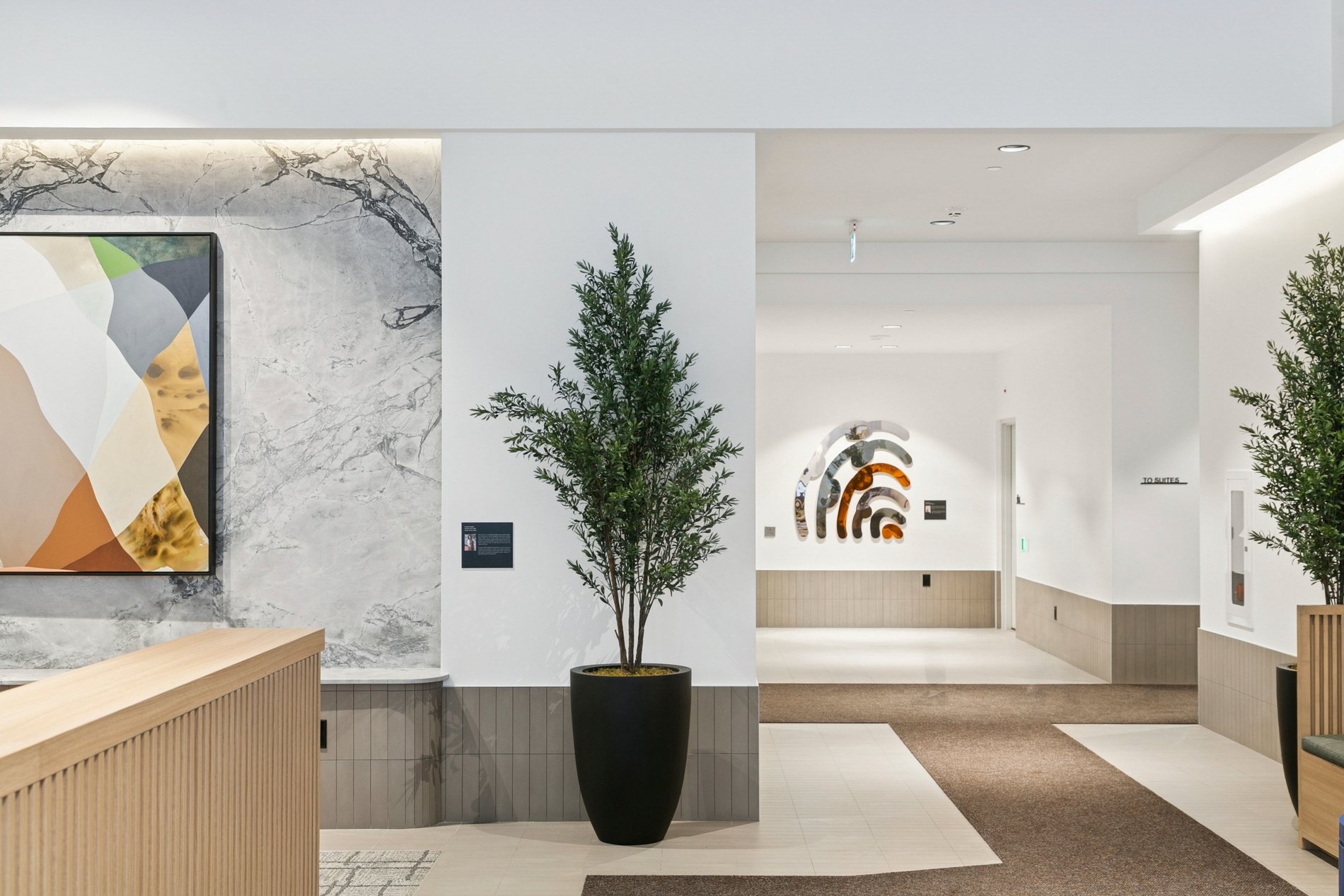 Modern residential lobby with reception desk and contemporary design