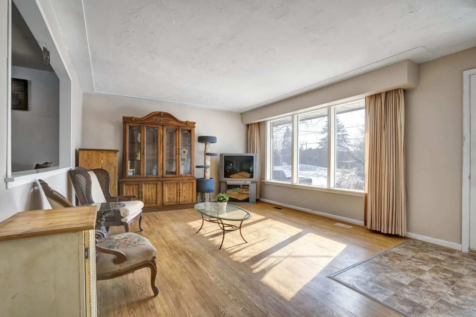 Warm Toronto short term rental interior with bright windows and city views