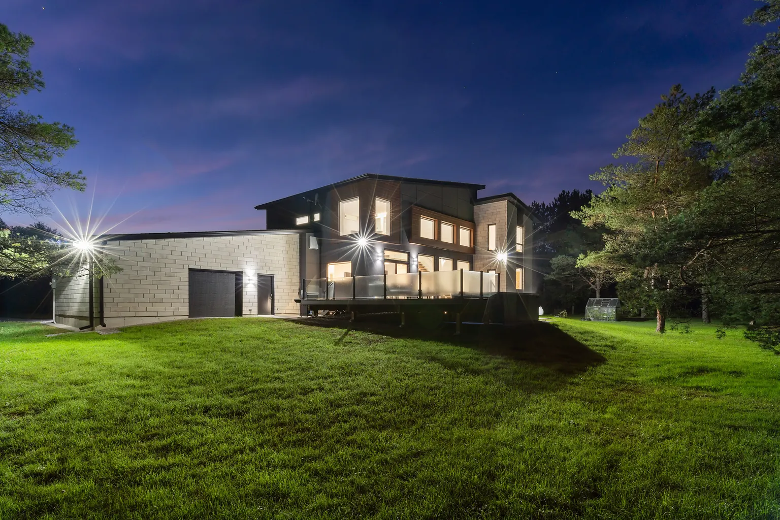 Twilight real estate photography of a Burlington home lit from inside at dusk