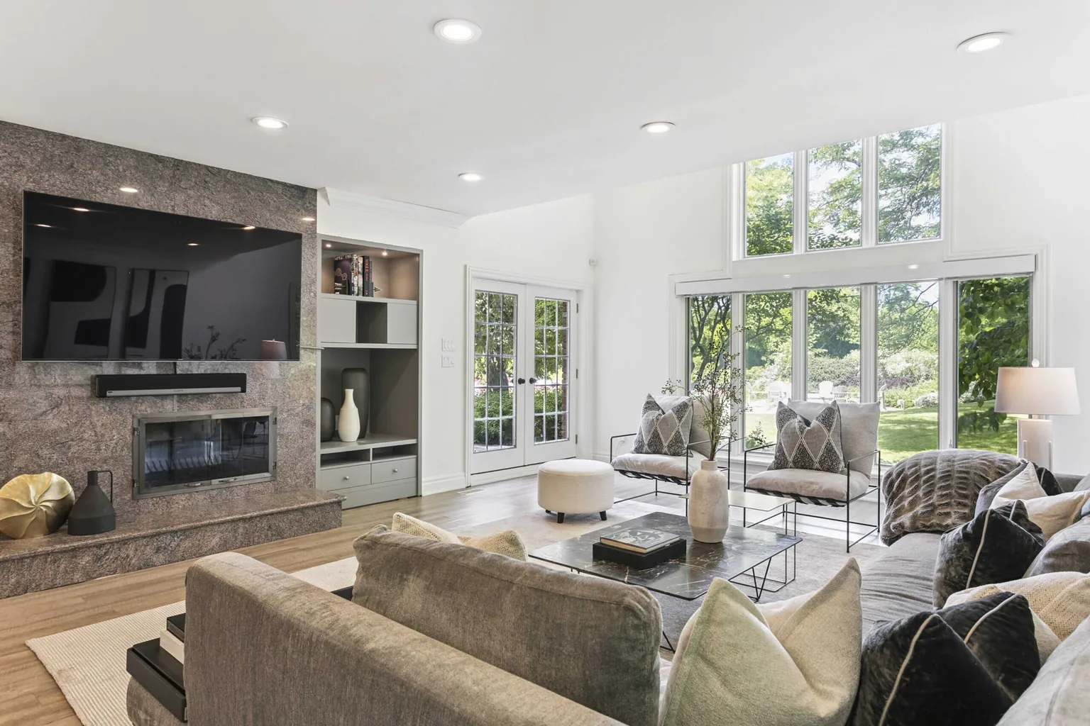 HDR real estate photography of an Etobicoke great room with a marble fireplace