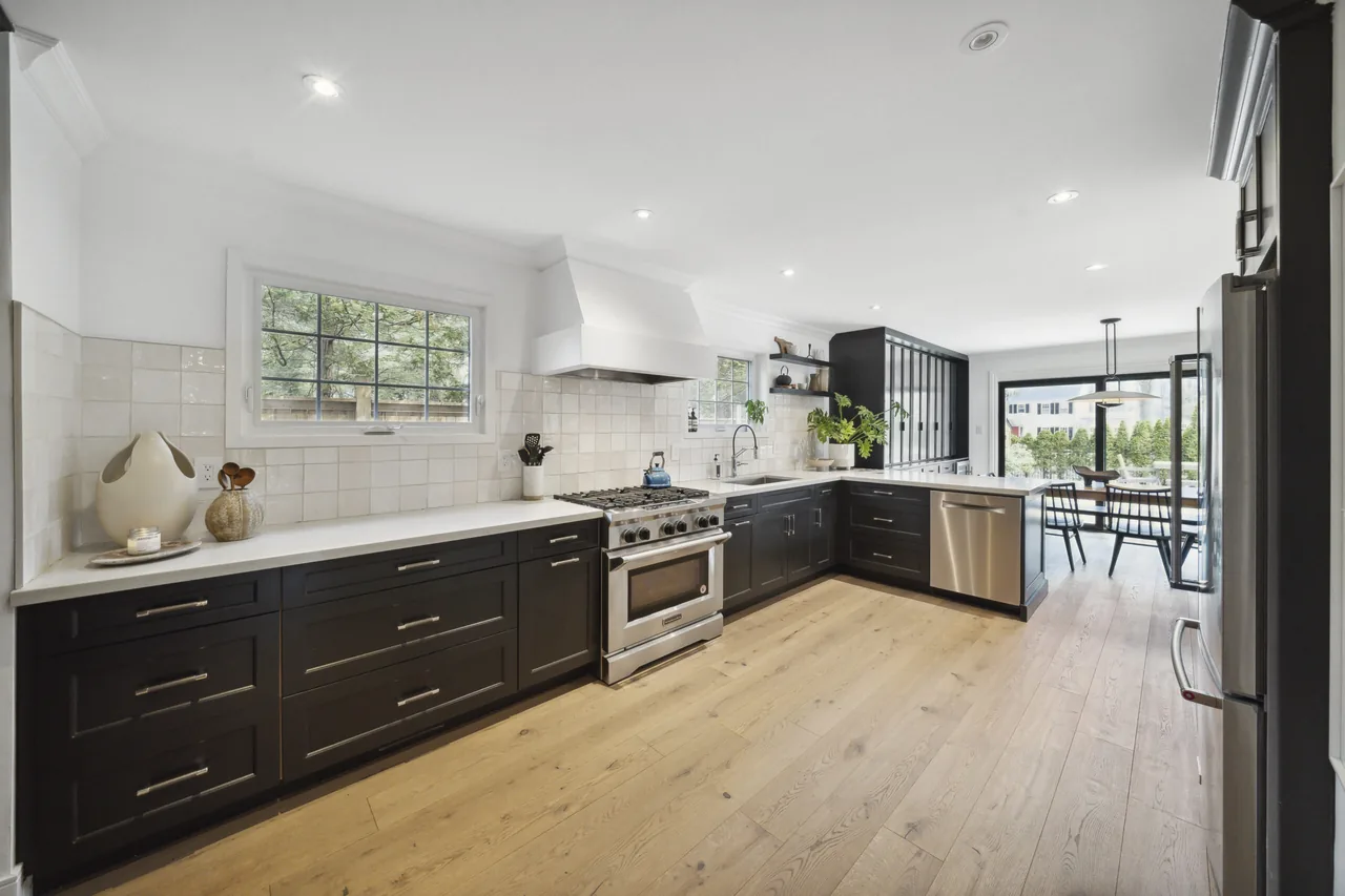 Bright HDR photo of a new build Milton kitchen with the subdivision beyond the balcony